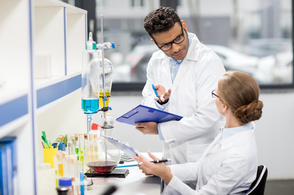 side view of scientists working in laboratory
